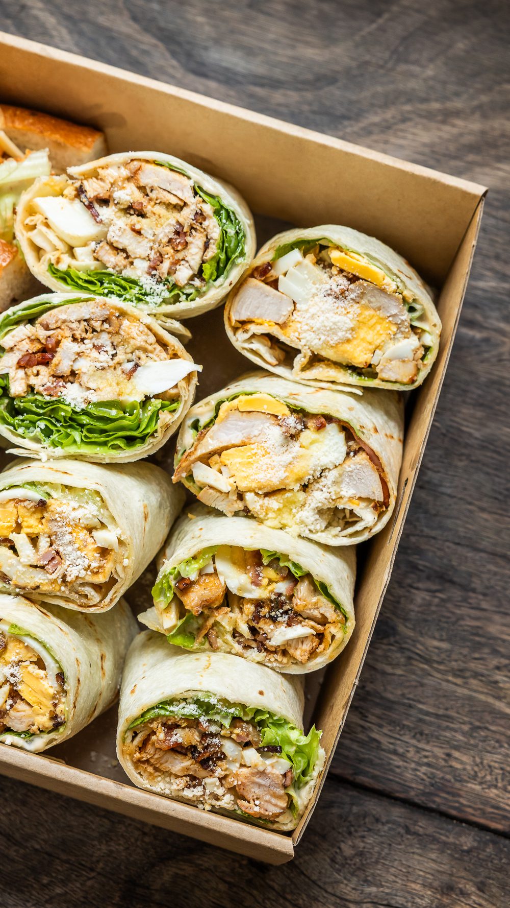 Catering box of sandwich wraps cut and arranged