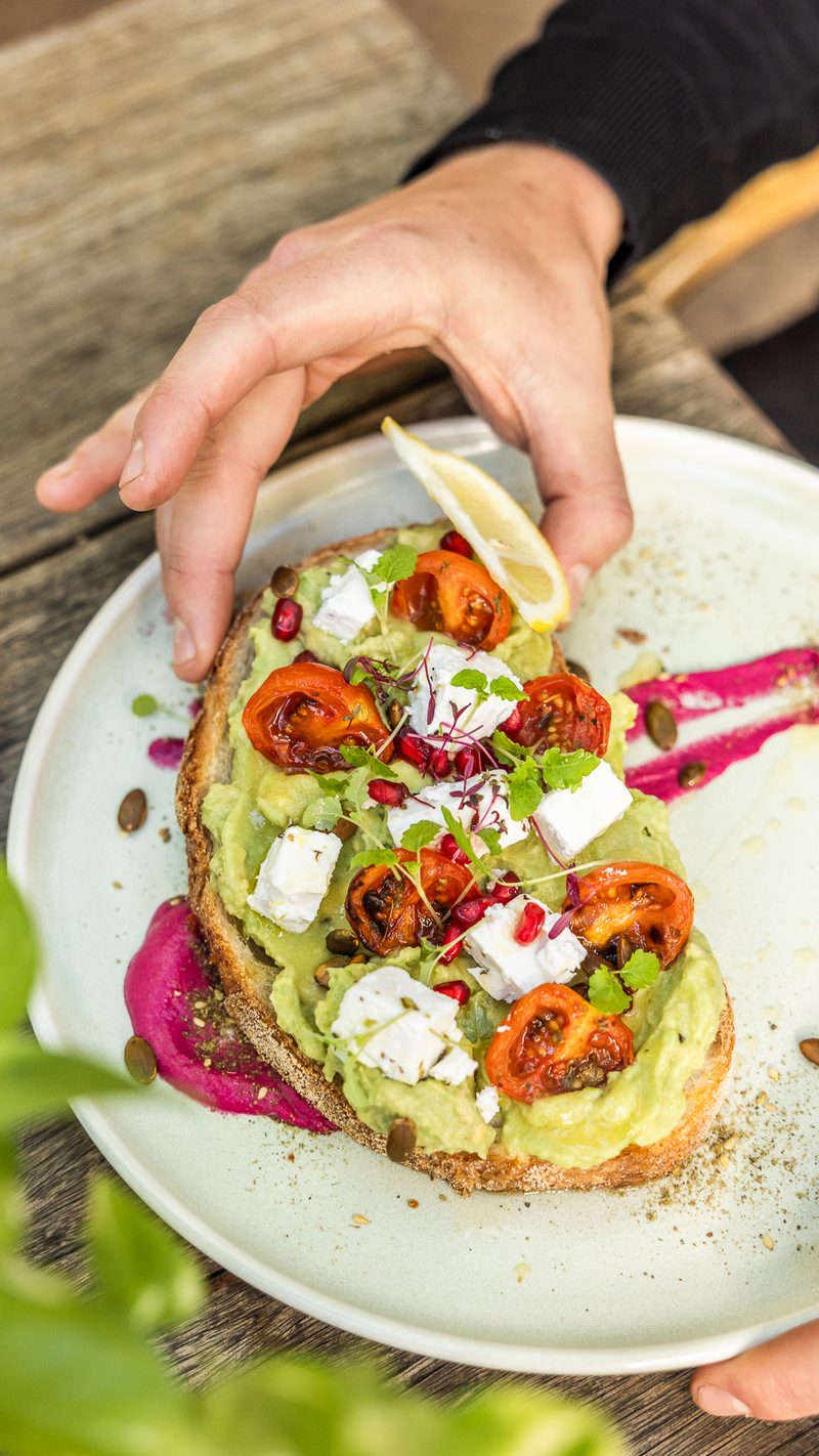 Smashed avocado toast with beetroot hummus and fetta