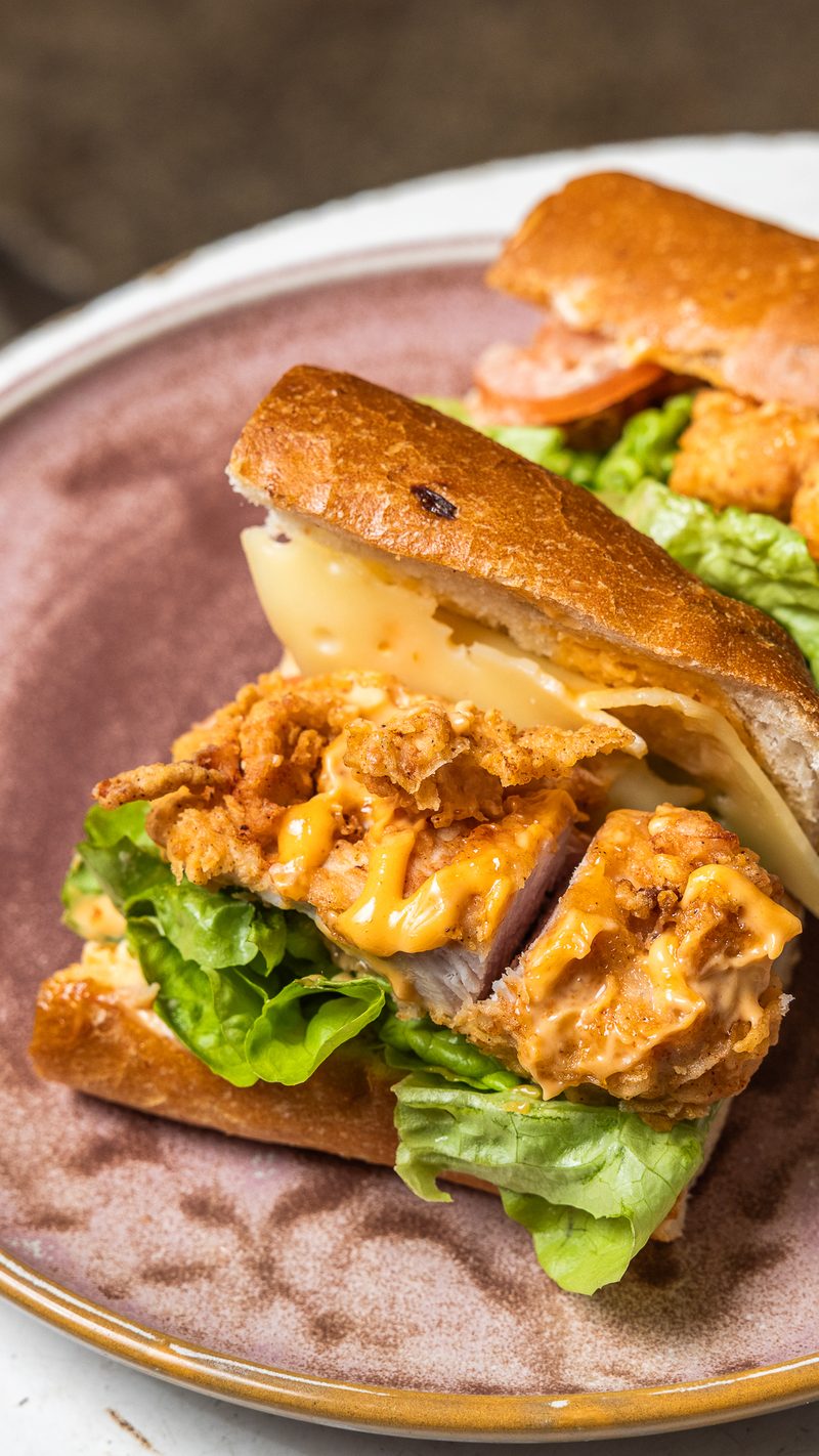 Crumbed chicken burger with slaw in a milk bun