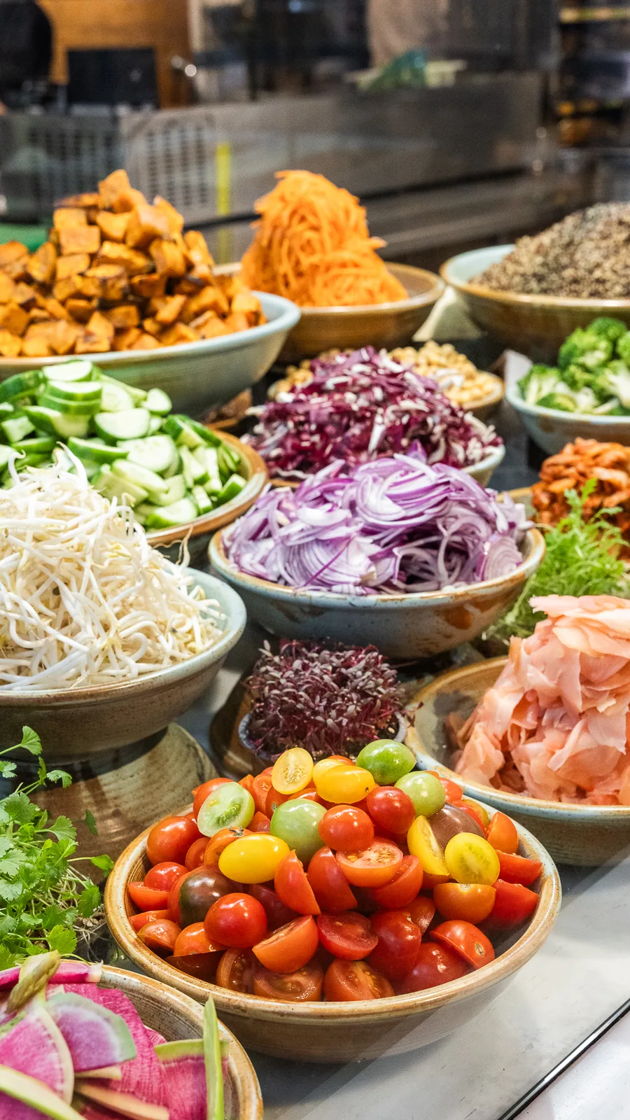 Overhead view of colourful salad bar ingredients at The Gardens 259